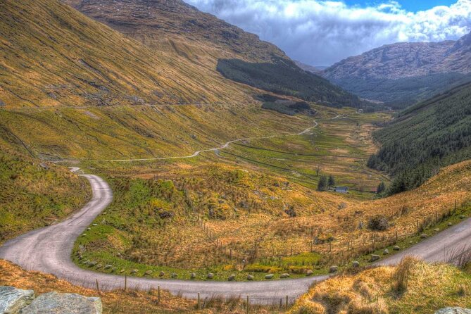 Full-Day Oban Castles and Glencoe Guided Tour from Glasgow - Loch Lomond and the Ben Lomond view through the bus
