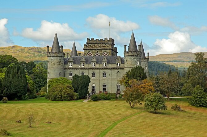 Greenock Ocean Terminal: Loch Lomond & Highland 7 Hr Private Tour - Luss on Loch Lomond: cottages, a pier view, and a graveyard story