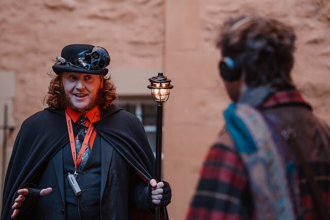 Immersive Old Town Ghost Walking Tour in Edinburgh - Stop 1 at Mercat Cross: villains, victims, and the opening shock