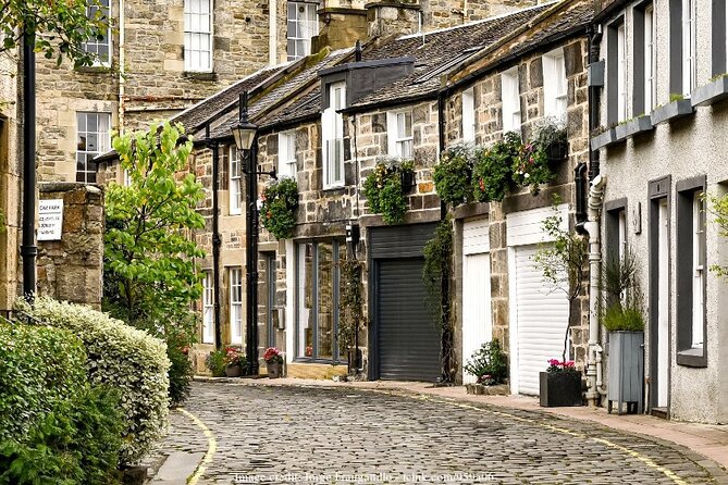 Off The Beaten Path Edinburgh: Dean Village Private Walking Tour - Stop 1: Dean Village walk, with mills, mews houses, and the Water of Leith